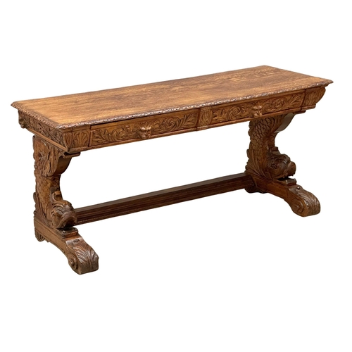 27 - A pair of large 19th Century Victorian carved oak console tables, with man of the forest drawers, ko... 