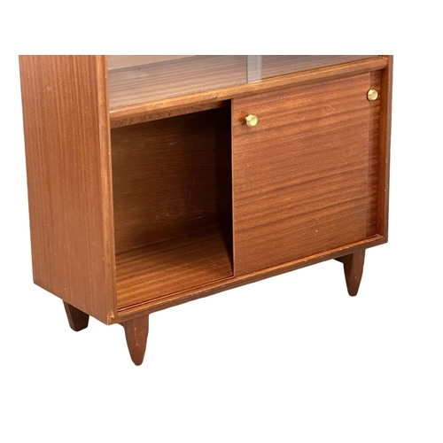 270 - Robert Heritage for Beaver & Tapley. A Mid Century teak “Multi-Width” bookcase, designed by Robert H... 