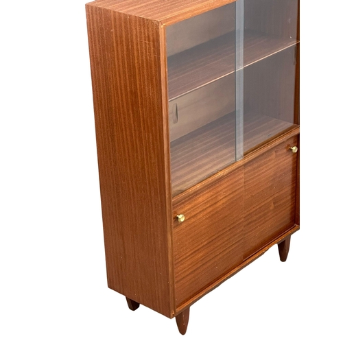 270 - Robert Heritage for Beaver & Tapley. A Mid Century teak “Multi-Width” bookcase, designed by Robert H... 