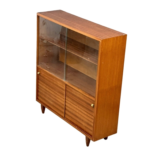 271 - Robert Heritage for Beaver & Tapley. A Mid Century teak “Multi-Width” bookcase, designed by Robert H... 