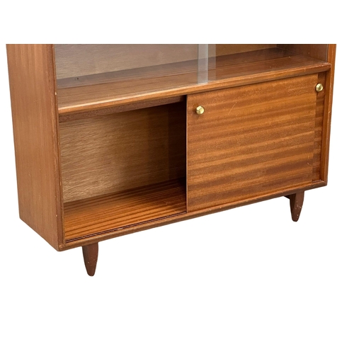 271 - Robert Heritage for Beaver & Tapley. A Mid Century teak “Multi-Width” bookcase, designed by Robert H... 