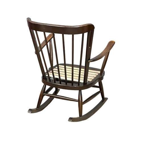 282 - A Mid Century Ercol style rocking chair.