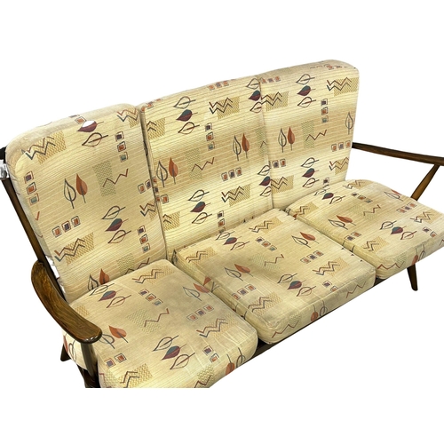 284 - A Mid Century Ercol style 3 seater sofa. 169cm