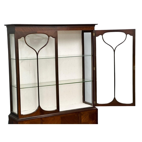 306 - A large Edwardian mahogany display cabinet. 123x39x188cm