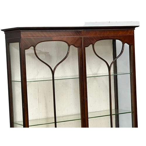 306 - A large Edwardian mahogany display cabinet. 123x39x188cm