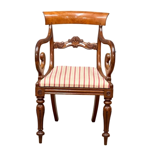 307 - A William IV mahogany bar back armchair with scrolled arms. Circa 1830. (7)