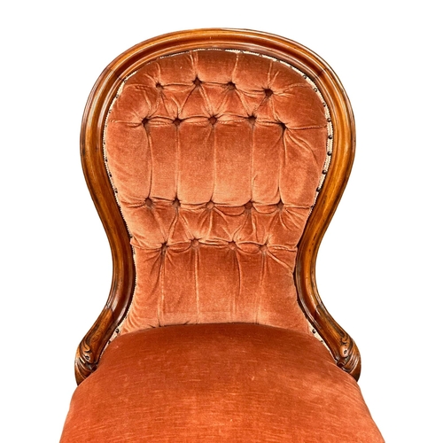 308 - A 19th Century Victorian mahogany deep button, spoon back bedroom chair/ladies chair on cabriole leg... 