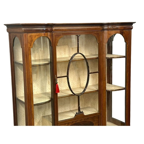 309 - A large Edwardian inlaid mahogany display cabinet, with bowed glass and astragal glazed doors on squ... 