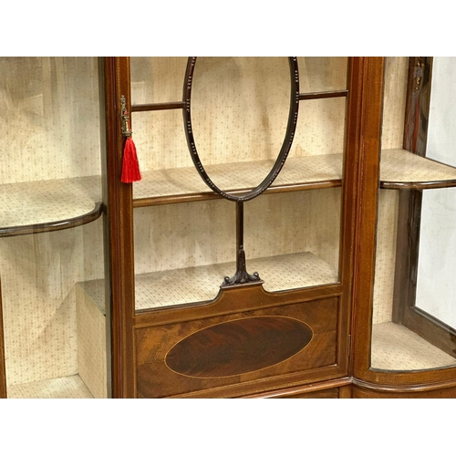 309 - A large Edwardian inlaid mahogany display cabinet, with bowed glass and astragal glazed doors on squ... 