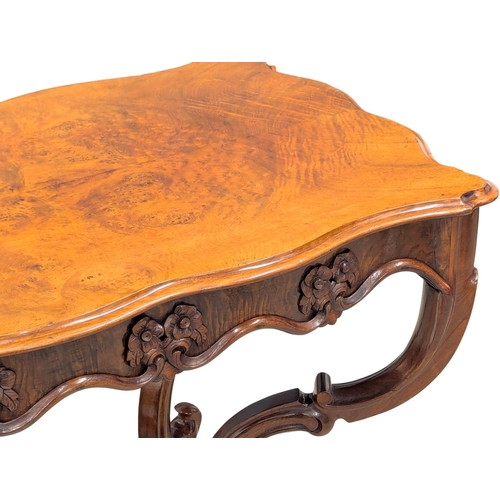 311 - A Victorian Burr Walnut centre table / side table with scallop shaped edge. Circa 1850s. 82x55x75cm