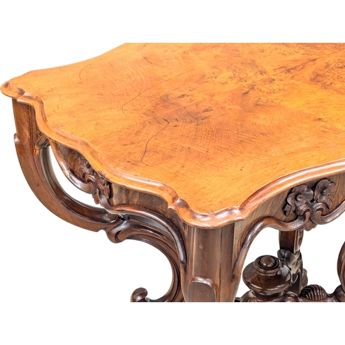 311 - A Victorian Burr Walnut centre table / side table with scallop shaped edge. Circa 1850s. 82x55x75cm