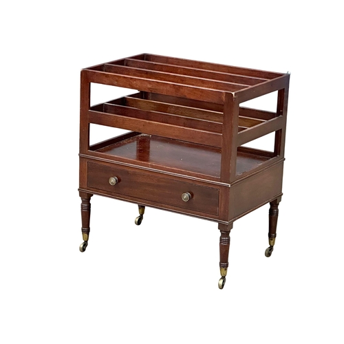 320 - A George IV mahogany Canterbury with drawer and brass cup casters. Circa 1820.