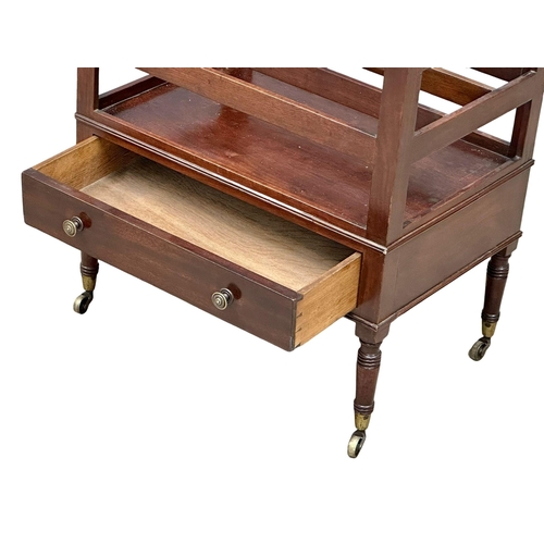 320 - A George IV mahogany Canterbury with drawer and brass cup casters. Circa 1820.