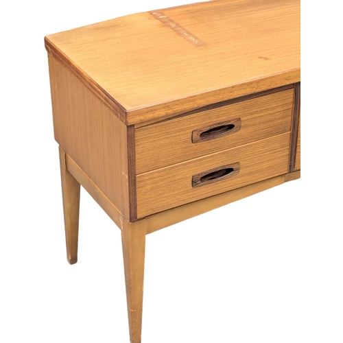 341 - Frank Guille. A Mid Century teak sideboard designed by Frank Guille for Austinsuite. 153x44x66.5cm