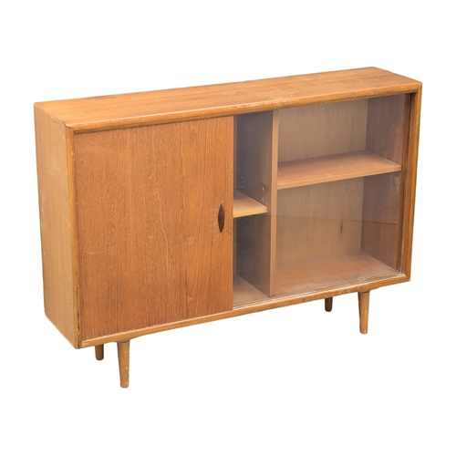 346 - Herbert Gibbs. A Mid Century teak bookcase by Herbert Gibbs. 107x25x76cm