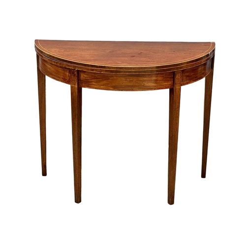 366 - A George III, Early 19th Century inlaid mahogany turnover tea table. In the Sheraton style. Circa 18... 