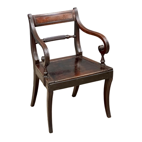 370 - A Regency Period, Early 19th Century mahogany armchair with scrolled arms and sabre legs. Circa 1810... 