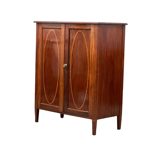 379 - An Edwardian, Sheraton Revival inlaid mahogany side cabinet, with interior shelves. 76x39x92cm. (3)