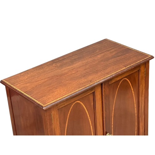 379 - An Edwardian, Sheraton Revival inlaid mahogany side cabinet, with interior shelves. 76x39x92cm. (3)