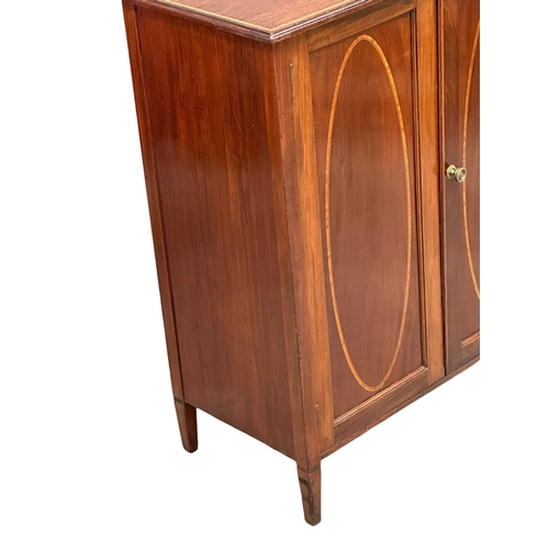 379 - An Edwardian, Sheraton Revival inlaid mahogany side cabinet, with interior shelves. 76x39x92cm. (3)