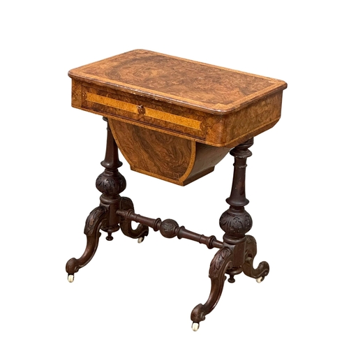 38 - A 19th Century Victorian burr walnut work table/side table, with maple interior drawer and carved ba... 