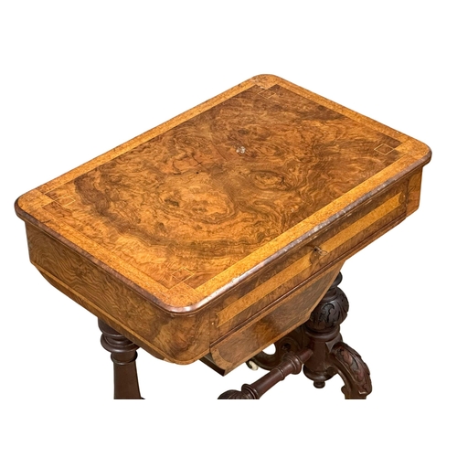 38 - A 19th Century Victorian burr walnut work table/side table, with maple interior drawer and carved ba... 