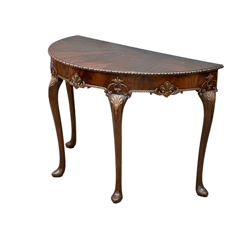 4 - A good quality Mid 19th Century Irish mahogany console table, in the George II style. With segmented... 