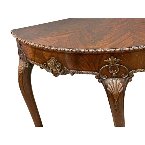 4 - A good quality Mid 19th Century Irish mahogany console table, in the George II style. With segmented... 