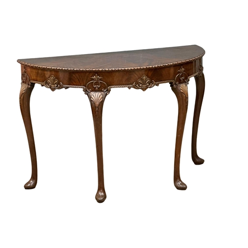 4 - A good quality Mid 19th Century Irish mahogany console table, in the George II style. With segmented... 