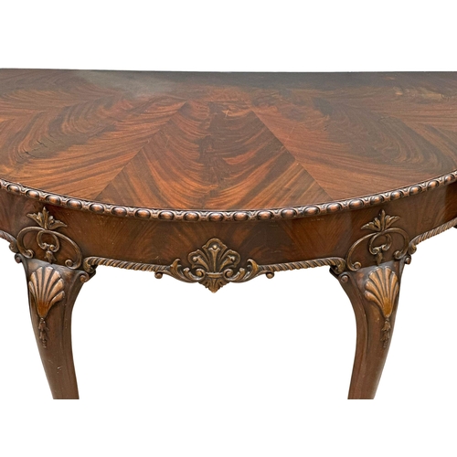 4 - A good quality Mid 19th Century Irish mahogany console table, in the George II style. With segmented... 