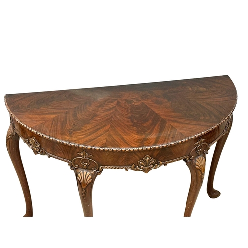 4 - A good quality Mid 19th Century Irish mahogany console table, in the George II style. With segmented... 