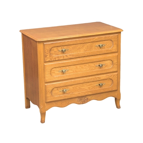 402 - A 18th Century style French oak chest of drawers. 83x45x76cm