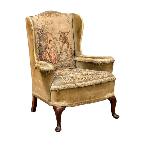 407 - An Early 20th Century Century Queen Anne style wingback armchair. Circa 1920.