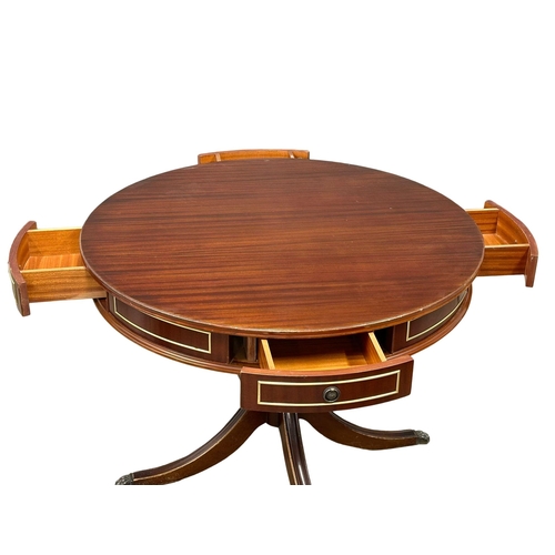 413 - A Georgian style mahogany drum dining table, with 4 drawers. 105x78cm