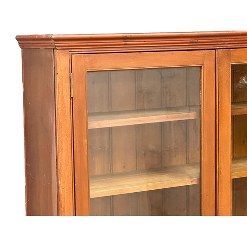 493 - A large 19th Century Victorian mahogany shops display cabinet/bookcase, with glazed doors and adjust... 