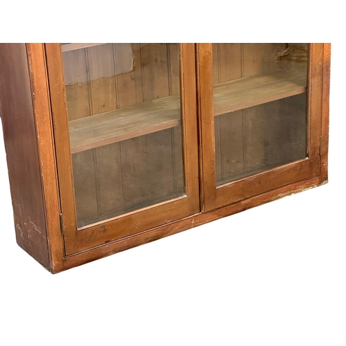 493 - A large 19th Century Victorian mahogany shops display cabinet/bookcase, with glazed doors and adjust... 