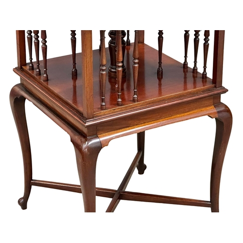 494 - A Late 19th/Early 20th Century inlaid mahogany revolving bookcase, on cabriole legs. Circa 1900. 44x... 