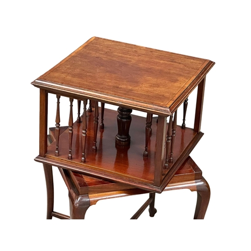 494 - A Late 19th/Early 20th Century inlaid mahogany revolving bookcase, on cabriole legs. Circa 1900. 44x... 