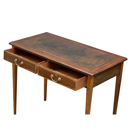 516 - An Edwardian inlaid mahogany writing table with 2 drawers and leather top. Sheraton Revival. 92x48x7... 