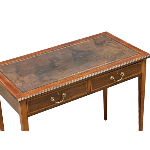 516 - An Edwardian inlaid mahogany writing table with 2 drawers and leather top. Sheraton Revival. 92x48x7... 