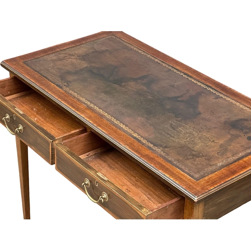 516 - An Edwardian inlaid mahogany writing table with 2 drawers and leather top. Sheraton Revival. 92x48x7... 