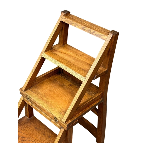 52 - A large good quality oak metamorphic library chair.