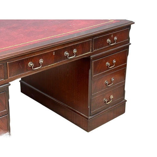 53 - A large George III style mahogany pedestal desk, with leather top. 153x93x79cm