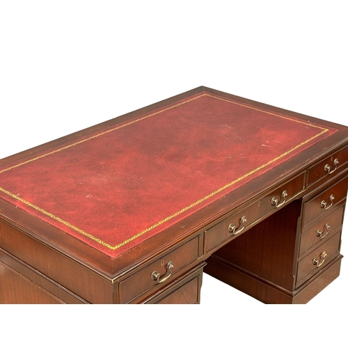 53 - A large George III style mahogany pedestal desk, with leather top. 153x93x79cm