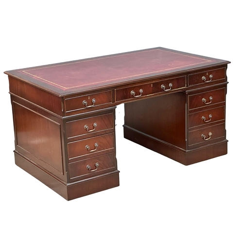 53 - A large George III style mahogany pedestal desk, with leather top. 153x93x79cm