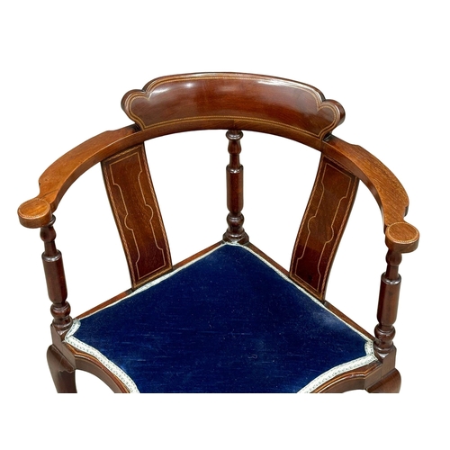 535 - An Edwardian inlaid mahogany corner armchair.