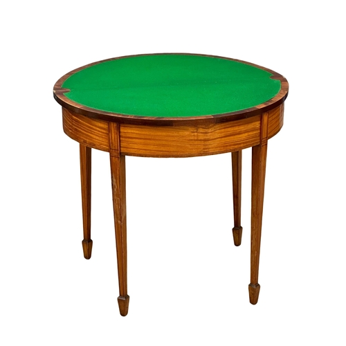 55 - A good quality Early 20th Century Hepplewhite Revival games table in burr satinwood and satinwood, w... 