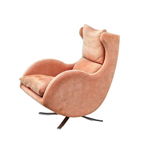 583A - A Fama Lenny Chair. Bellagio. Swivel armchair. Mid Century style.