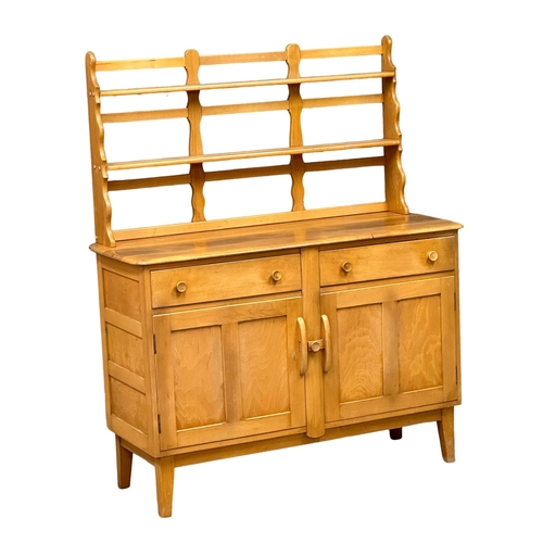 60 - An Ercol Mid Century elm and beech Windsor sideboard, with back plate rack. 131x50x156cm. (2)