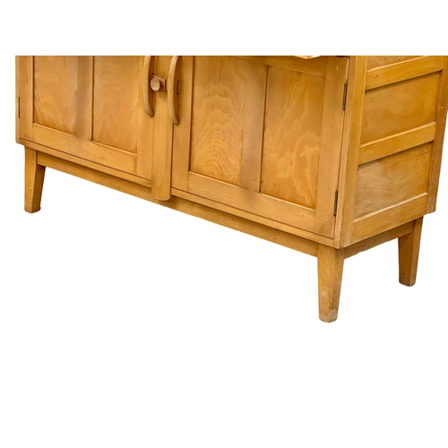 60 - An Ercol Mid Century elm and beech Windsor sideboard, with back plate rack. 131x50x156cm. (2)